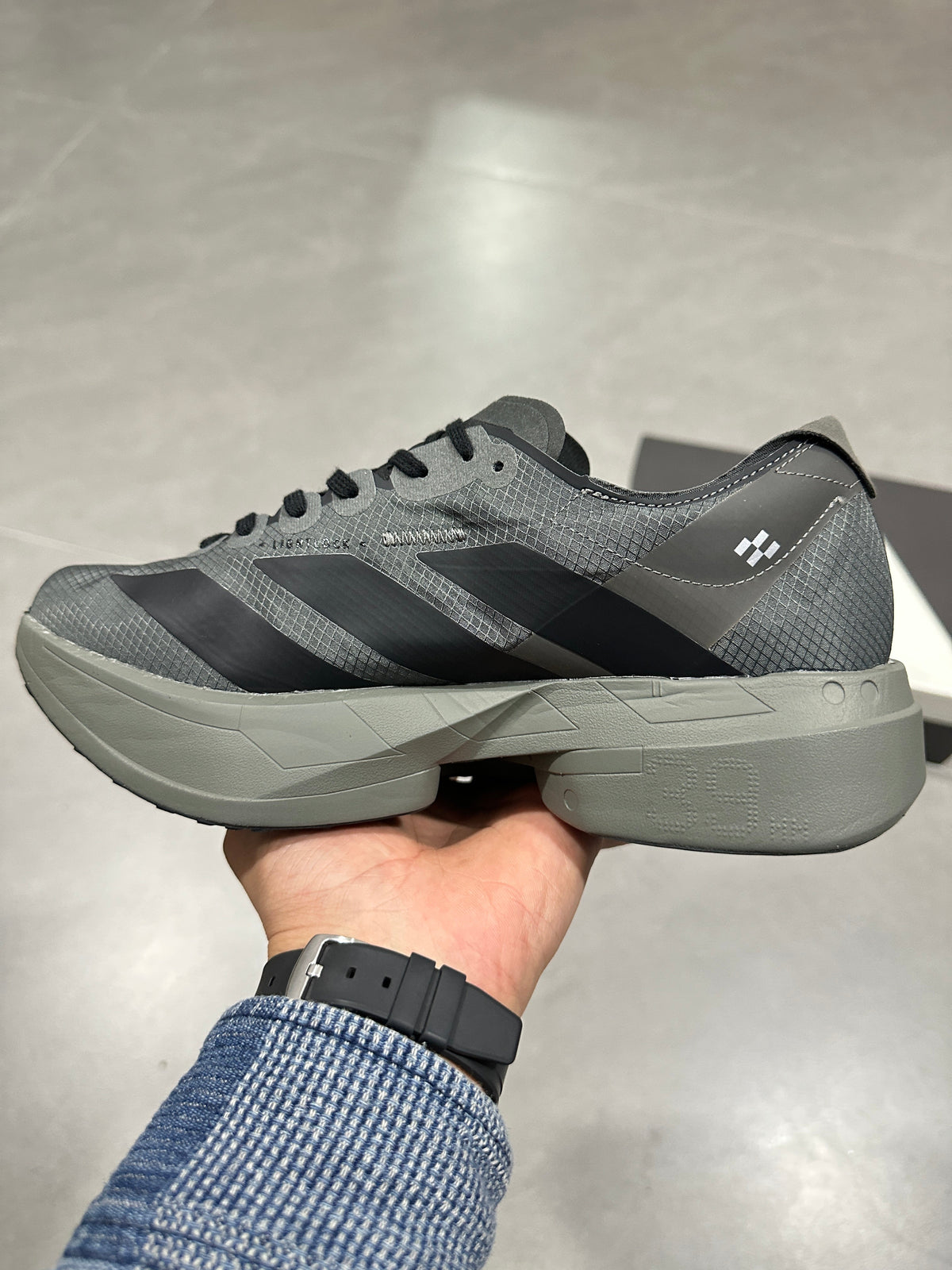 Adidas Adizero Adios Pro 4 Running Shoes in Grey Black - product image from the listing.