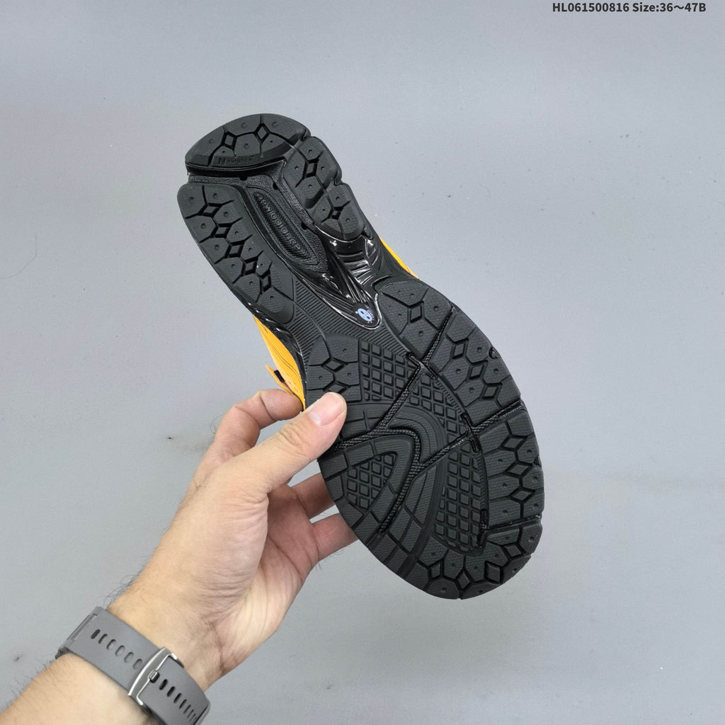 New Balance M1906R Sneakers in Pink Yellow Black U1906596 - product image from the listing.