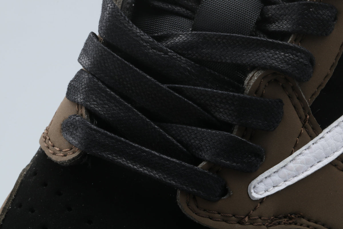 Black and Brown Sneakers with White Swoosh - Jordan 1 Low - product image from the listing.