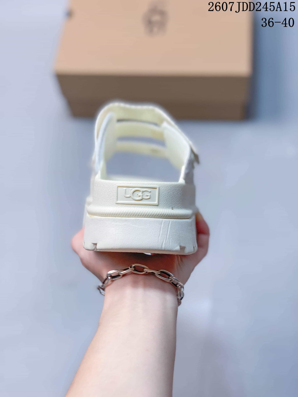 White UGG GoldenGlow Slide Sandals - product image from the listing.