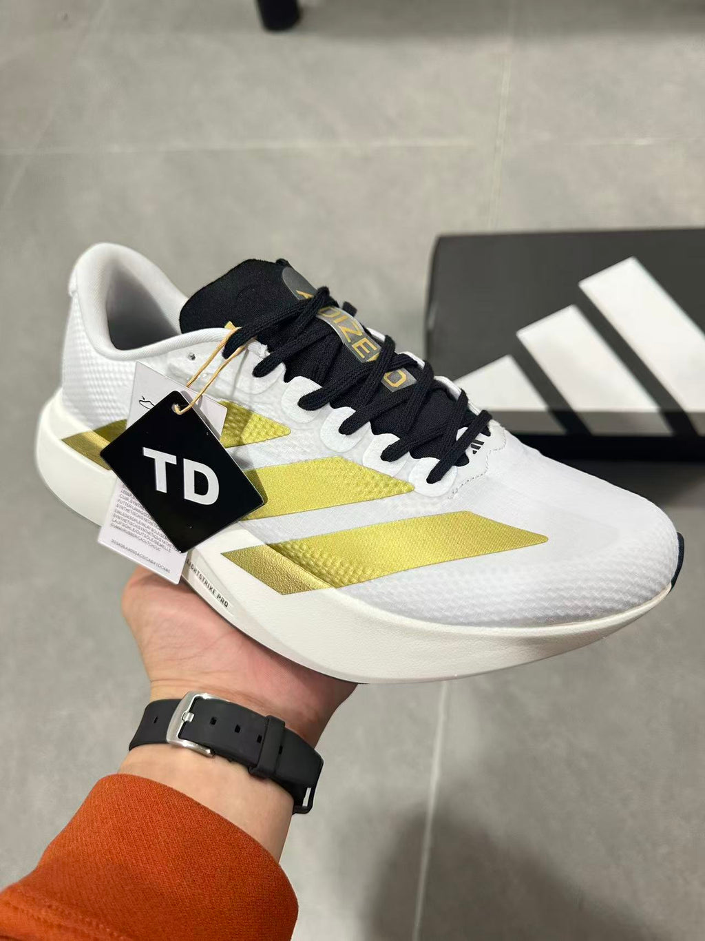 Adidas Lightstrike Pro Running Shoes in White Gold JQ4441 - product image from the listing.