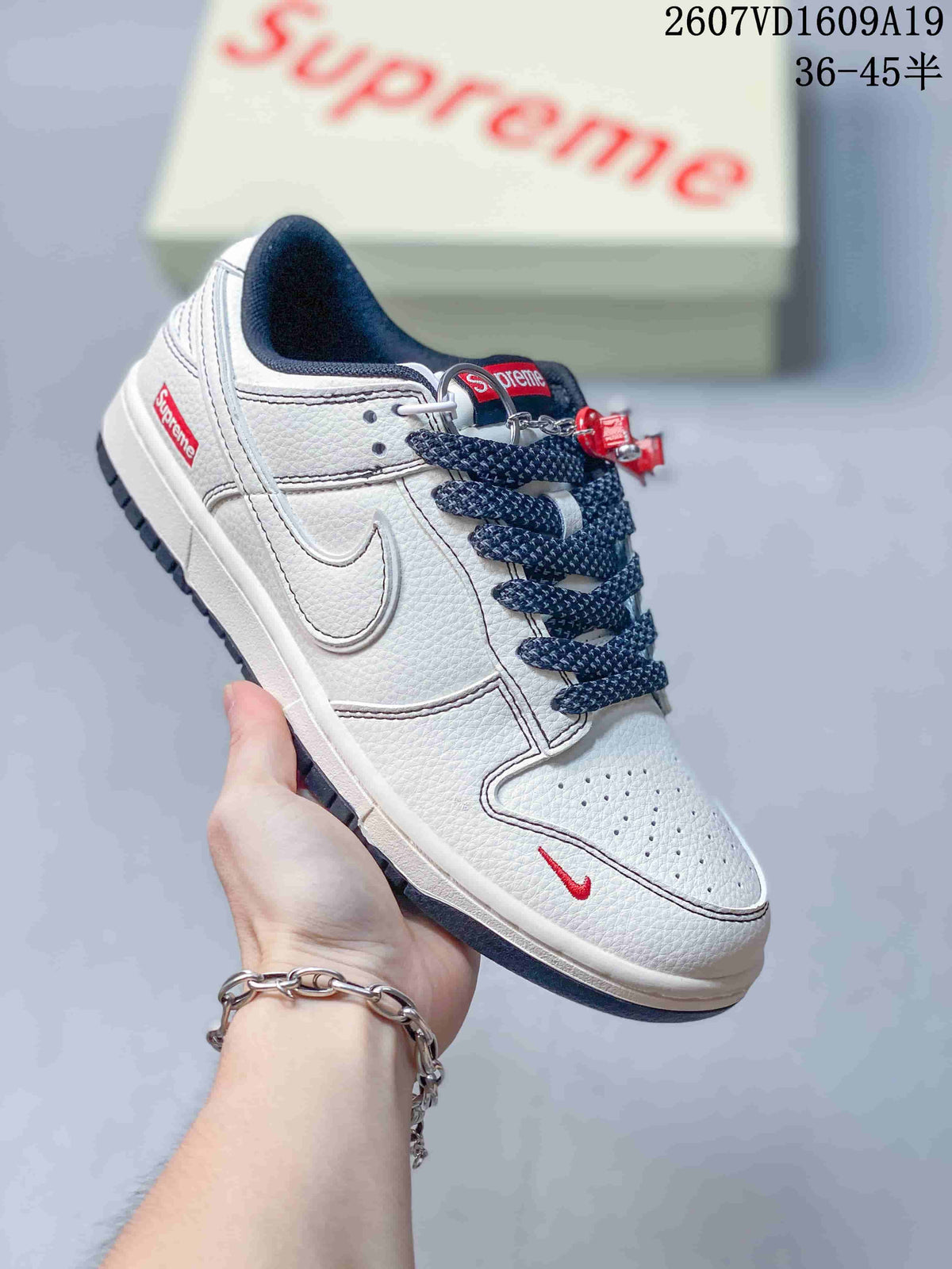Nike Dunk Low Retro Custom Sneakers in White and Navy - product image from the listing.