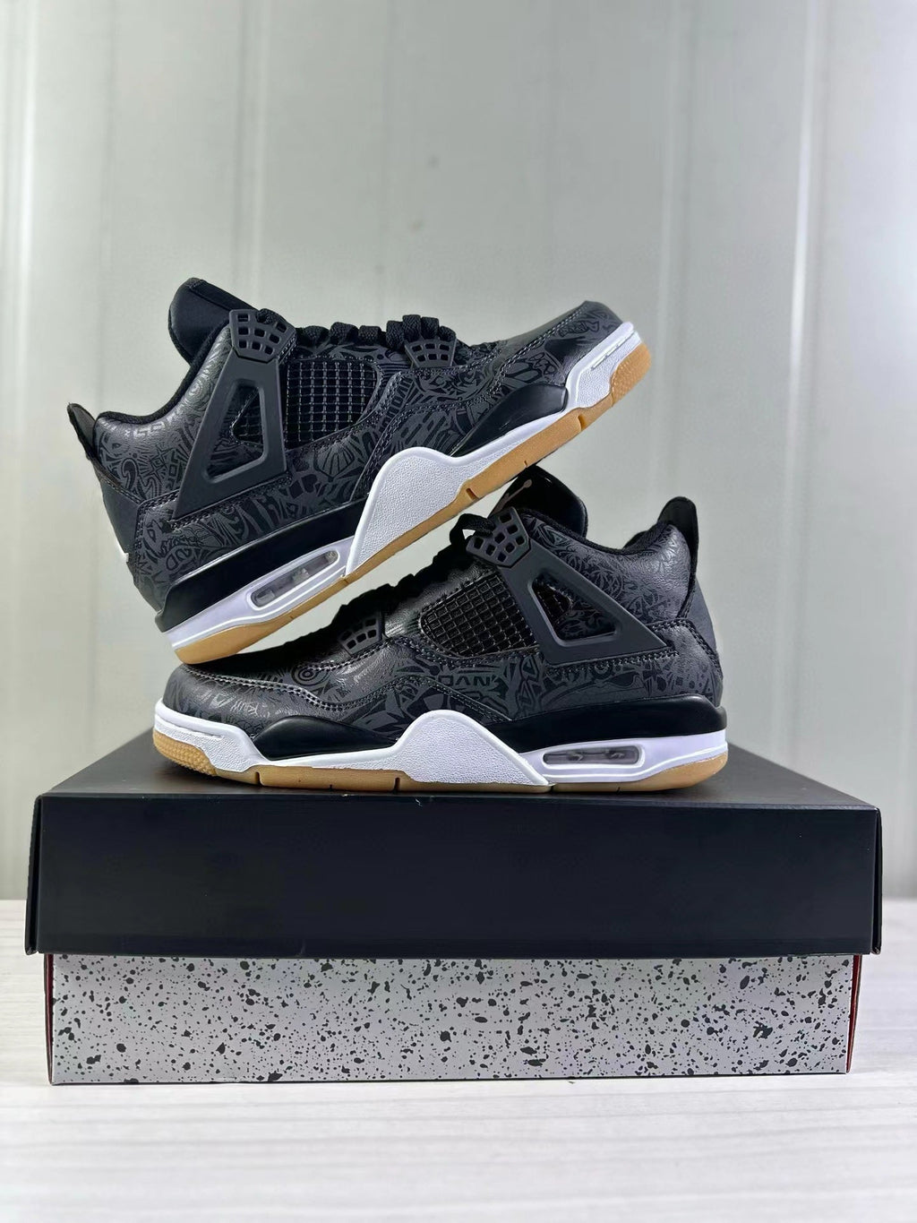 Air Jordan 4 Black Laser Sneakers CI2970-001 - product image from the listing.