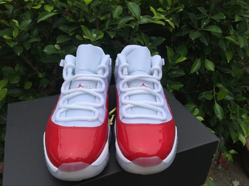 Air Jordan 11 Low Sneakers White Red - product image from the listing.