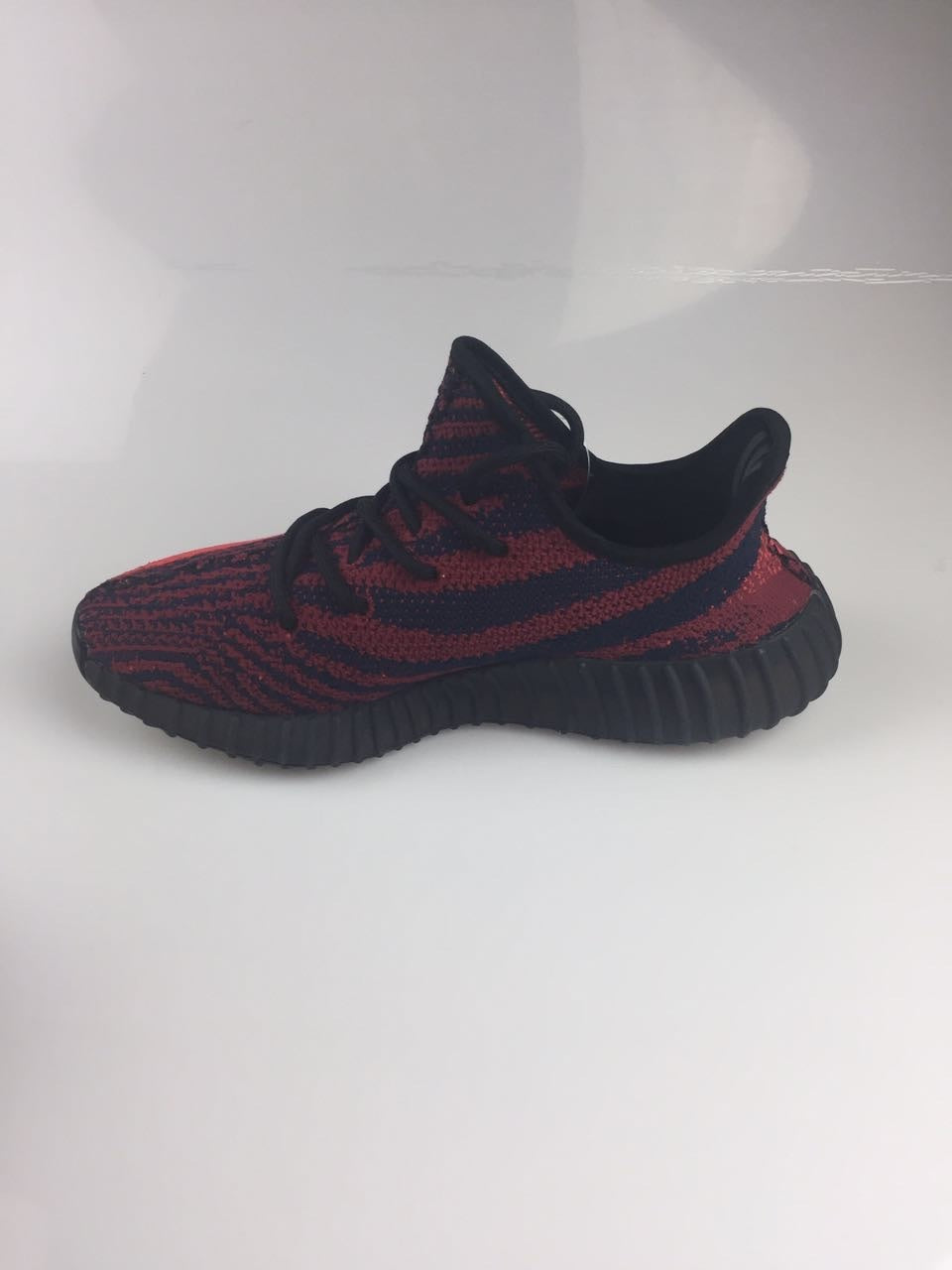 Adidas Yeezy Boost 350 V2 Sneakers in Black and Burgundy - product image from the listing.