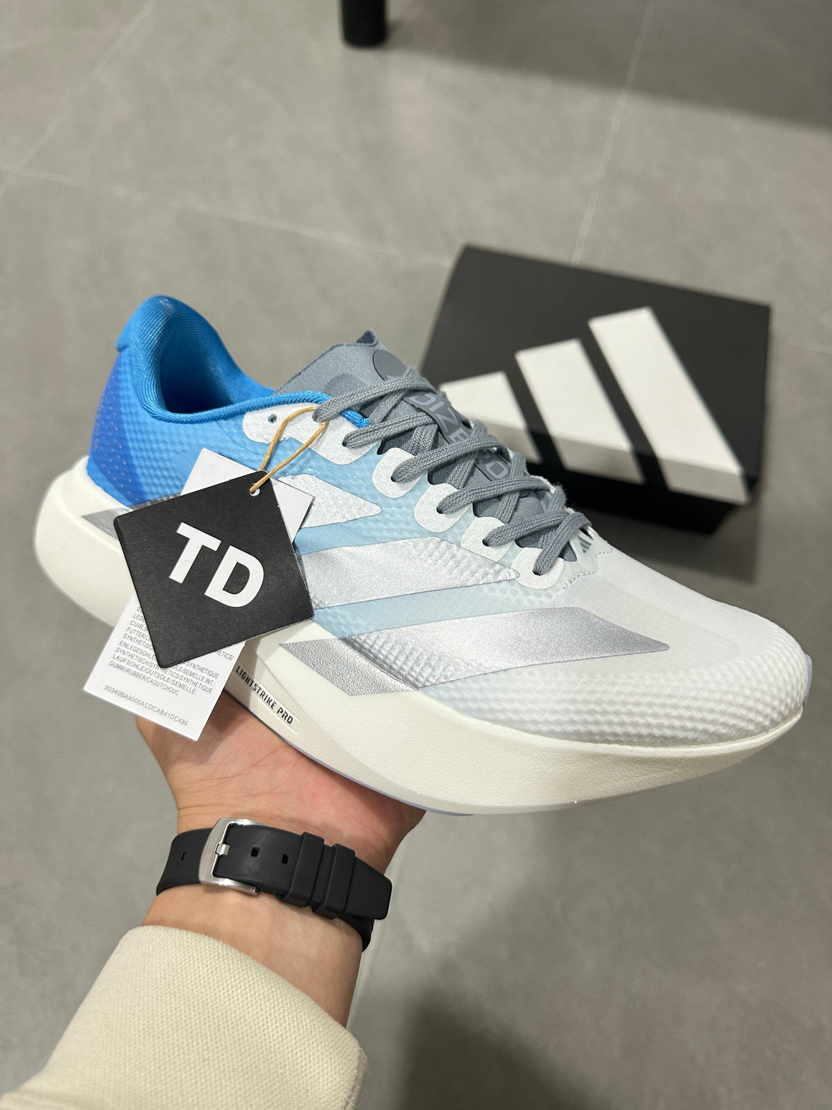 adidas Adizero EVO SL Running Shoes in White Blue JR2027 - product image from the listing.