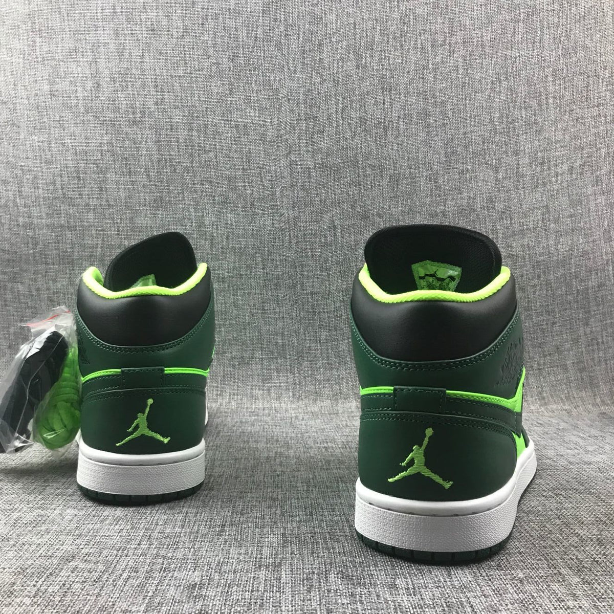 Air Jordan 1 Mid Fluorescent Sneakers in Green 554724-330 - product image from the listing.