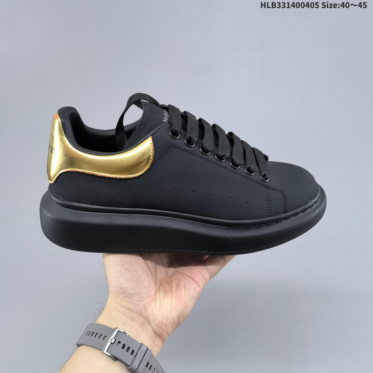Alexander McQueen Oversized Low-Cut Sneakers, Black and Gold, HLB331400405 - product image from the listing.