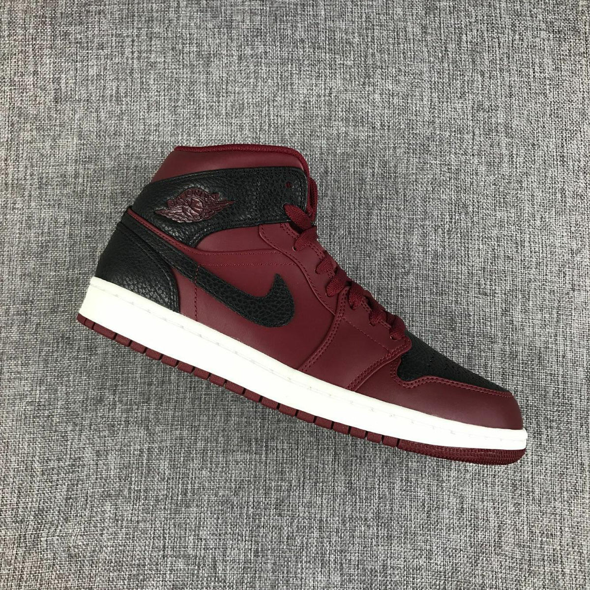 Air Jordan 1 Mid Sneakers in Black and Burgundy 554724-601 - product image from the listing.