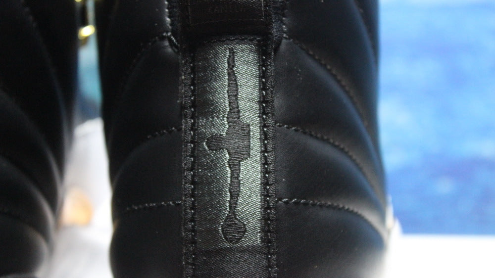 Air Jordan 12 Wings Black White Gold Sneakers 848692-033 - product image from the listing.