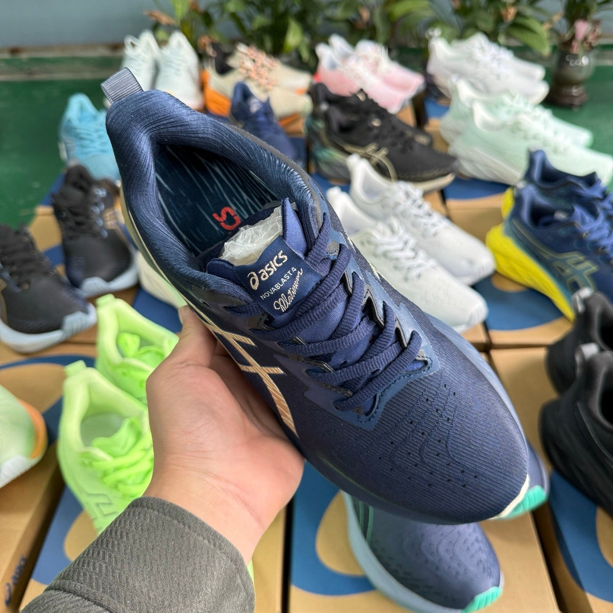 ASICS NOVABLAST 4 Running Shoes, in Blue and Gold - product image from the listing.