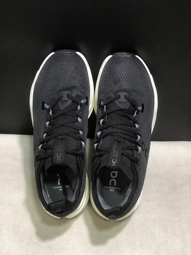 On Cloudsurfer Max Running Sneakers in Black and White - product image from the listing.