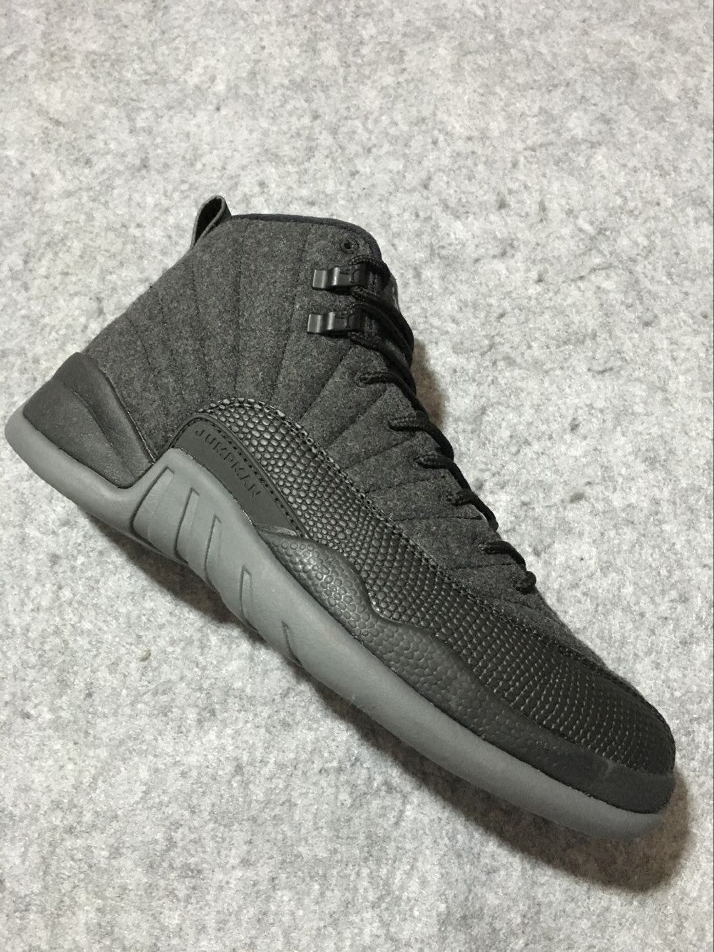 Black and Grey Air Jordan 12 High-Top Sneakers - product image from the listing.