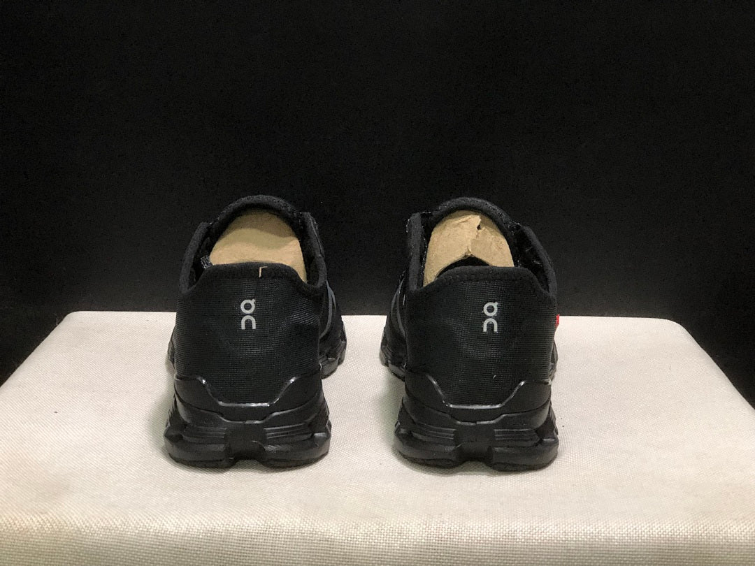 On Cloud X 4 AD Sneakers in Black - product image from the listing.