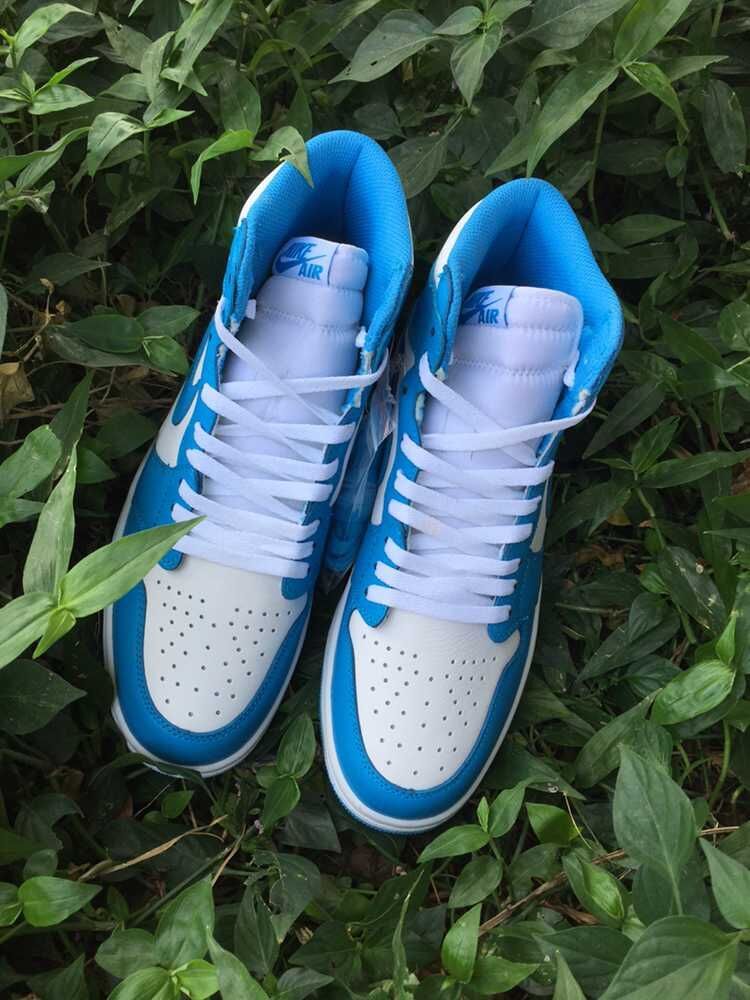 Blue and White Air Jordan 1 High Sneakers - product image from the listing.