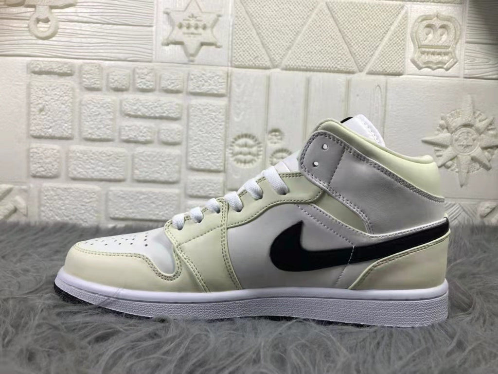 Jordan Air 1 Mid Sneakers in Cream White and Black - product image from the listing.