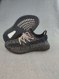 Black and Cream Yeezy 350 V2 Knit Sneakers - product image from the listing.