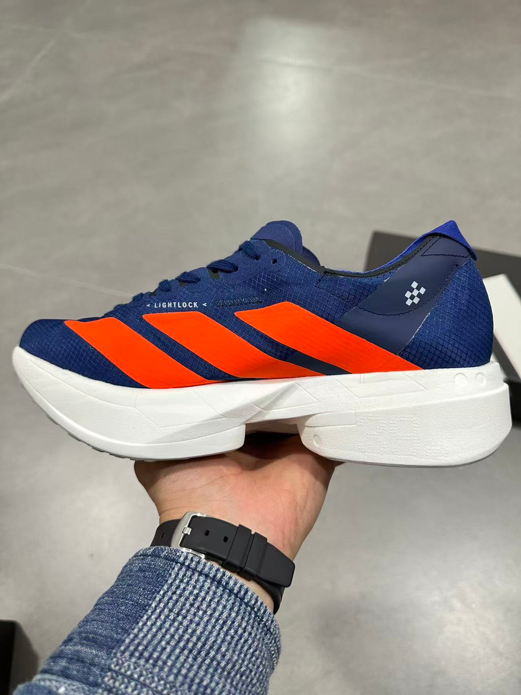Nike Adizero Lightstrike Pro Running Shoes, in Navy and Orange - product image from the listing.