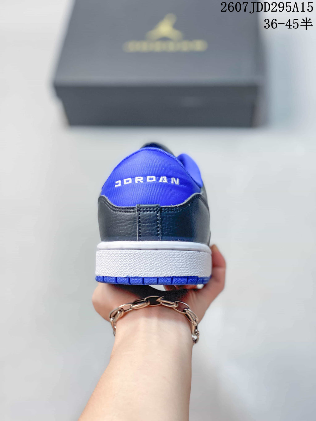 Air Jordan 1 Low Black Blue White Sneakers - product image from the listing.