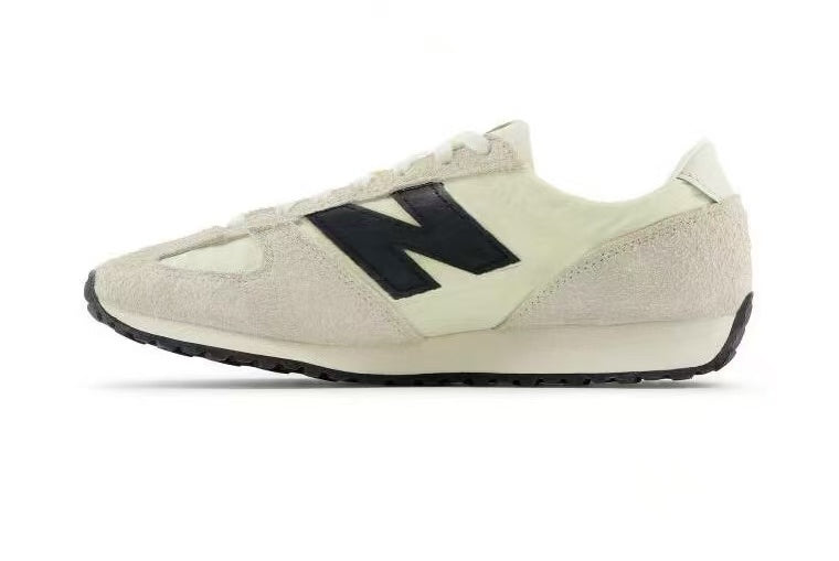 Cream and Black New Balance U471AM Sneakers - product image from the listing.