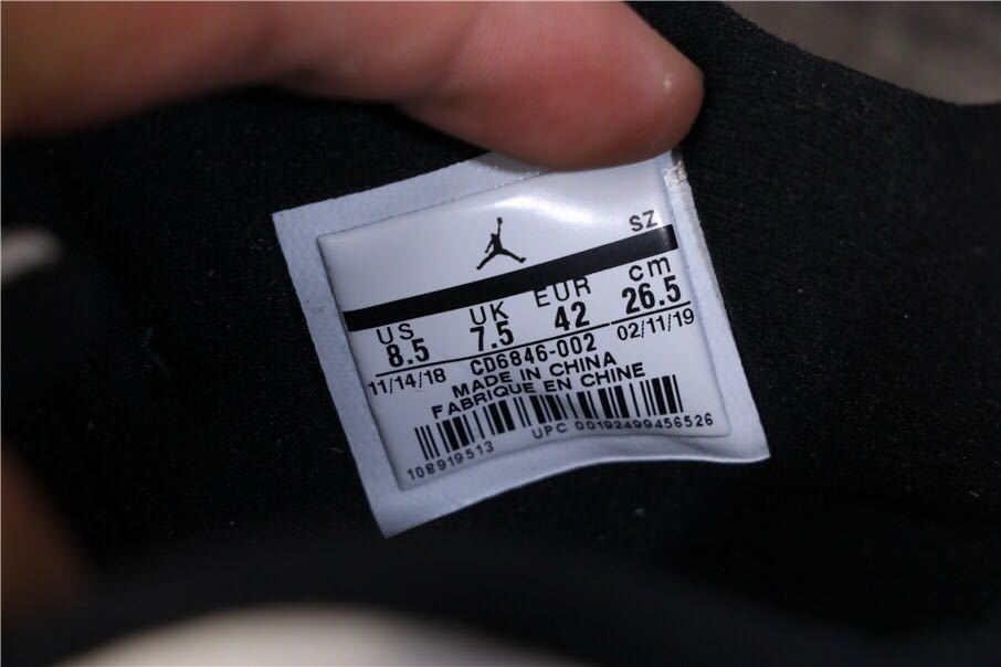 Air Jordan 11 Retro Low White Black Snakeskin Sneakers - product image from the listing.