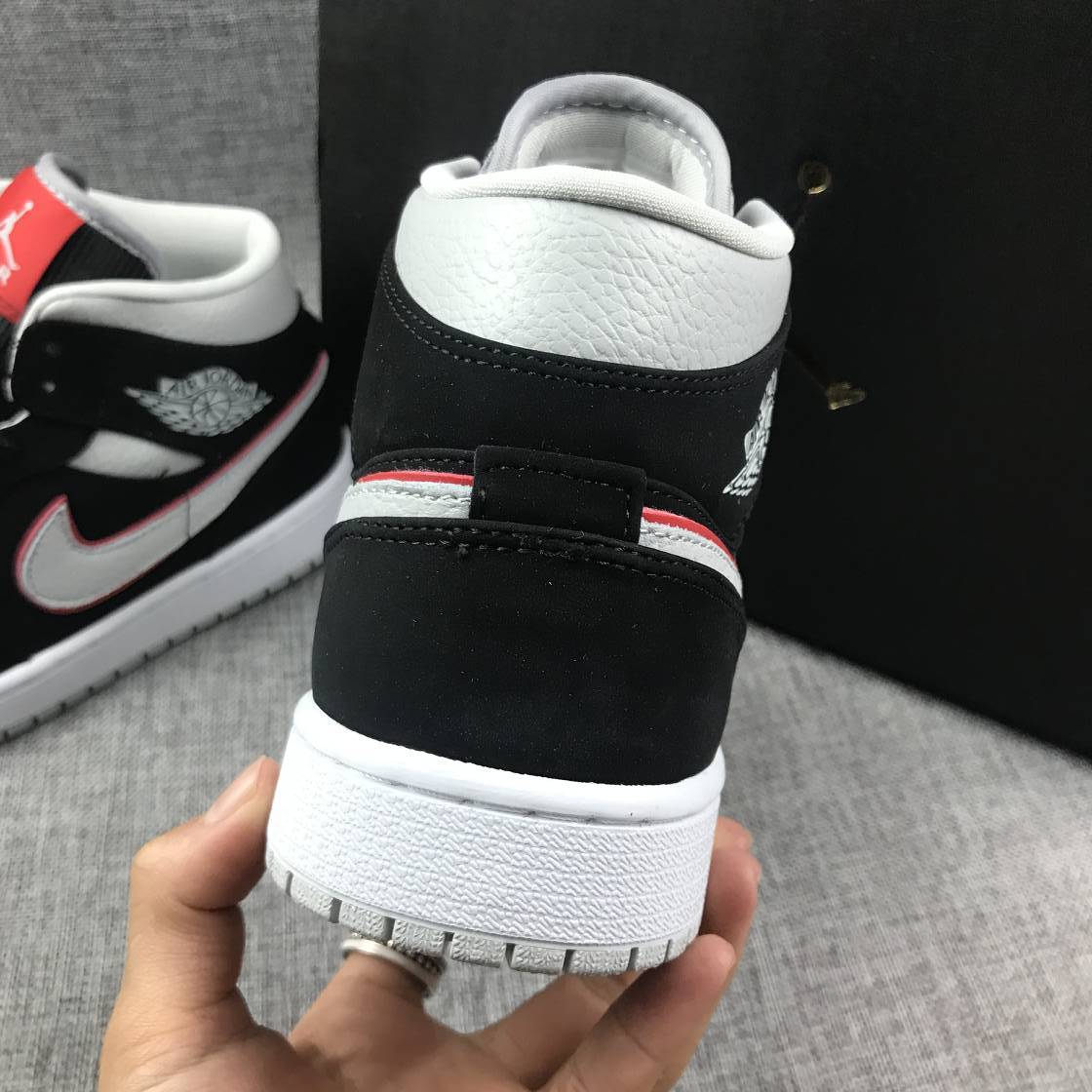 Air Jordan 1 Mid Black, Sneakers in White & Red 554724-060 - product image from the listing.