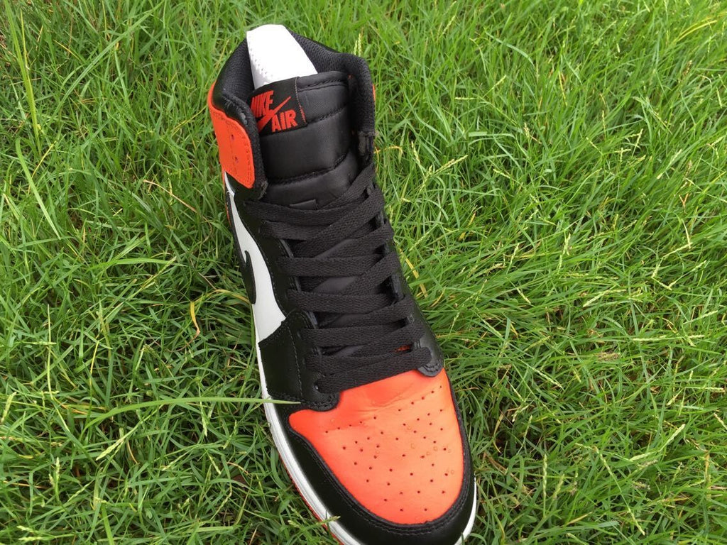 Women's Jordan 1 High Black Orange White Sneakers - product image from the listing.