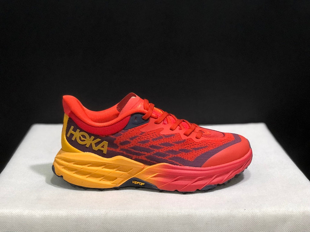 HOKA Speedgoat 5 Trail Running Shoes in Red and Yellow - product image from the listing.