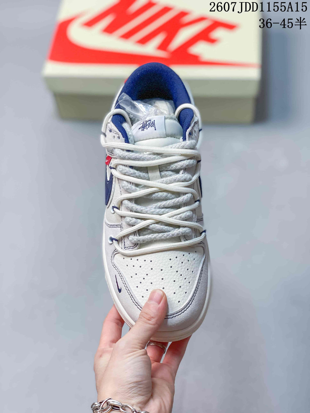 Nike SB Dunk Low Stussy Sneakers in White Grey Navy - product image from the listing.