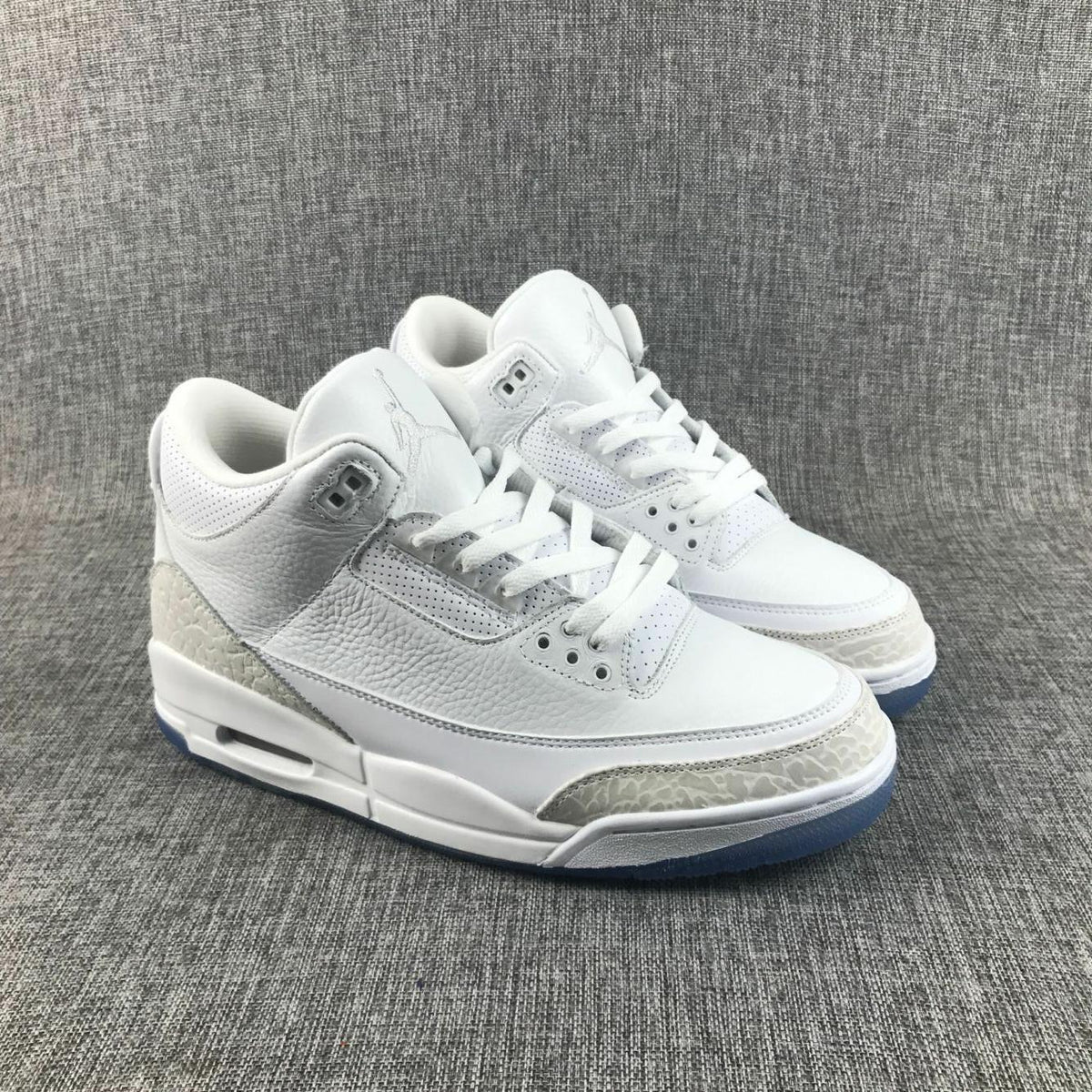 White Cement Sneakers with Blue Translucent Sole - Jordan 3 - product image from the listing.