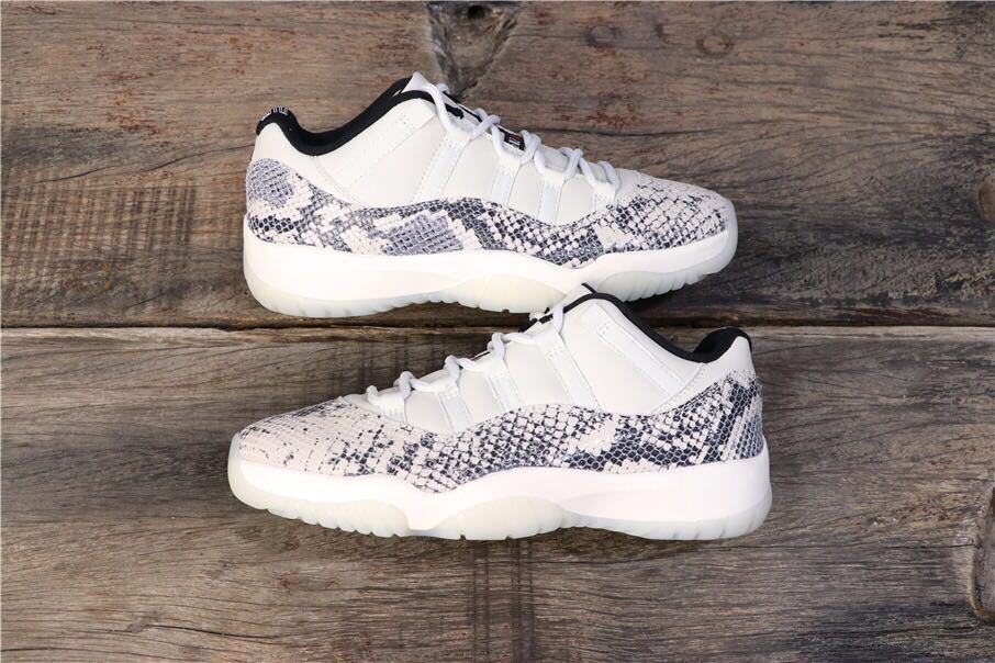 Air Jordan 11 Retro Low White Black Snakeskin Sneakers - product image from the listing.