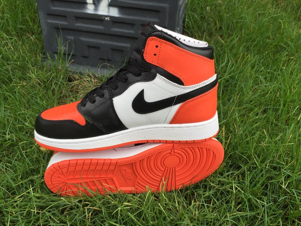 Women's Jordan 1 High Black Orange White Sneakers - product image from the listing.