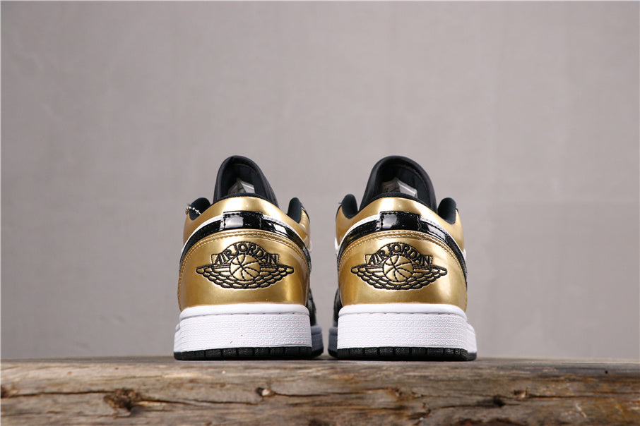 Jordan 1 Low Sneakers in Black Gold CQ9447-700 - product image from the listing.