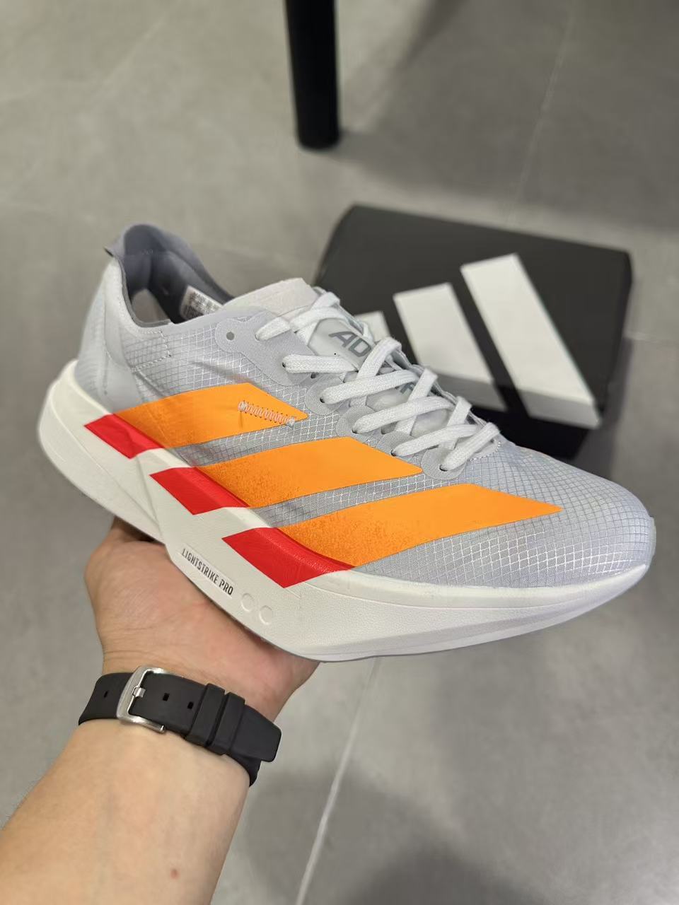 Adidas Adizero Lightstrike Pro Running Shoes in White Orange - product image from the listing.