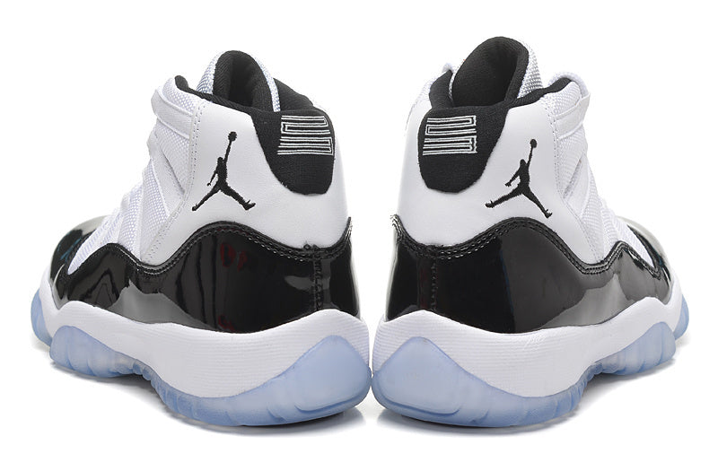 Air Jordan 11 Retro High White and Black Sneakers - product image from the listing.