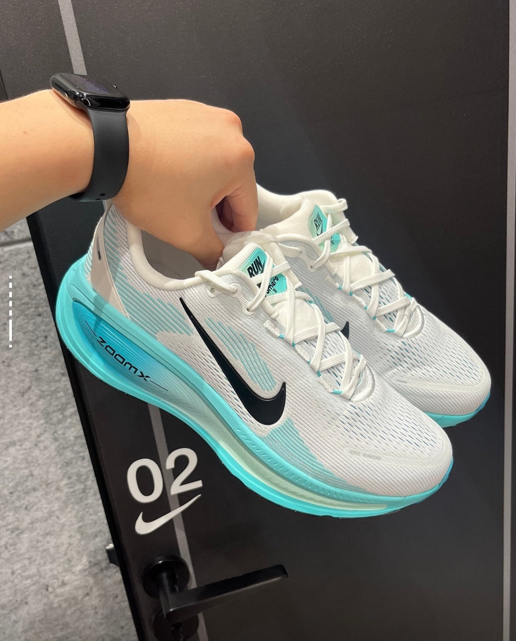 Nike Vomero 18 Running Shoes in White Aqua HM6803-103 - product image from the listing.