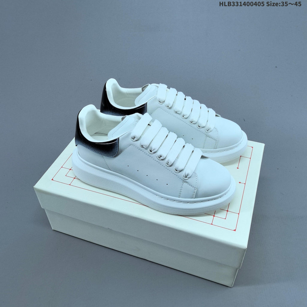 Alexander McQueen Oversized Low-Cut Sneakers, Black and Gold, HLB331400405 - product image from the listing.
