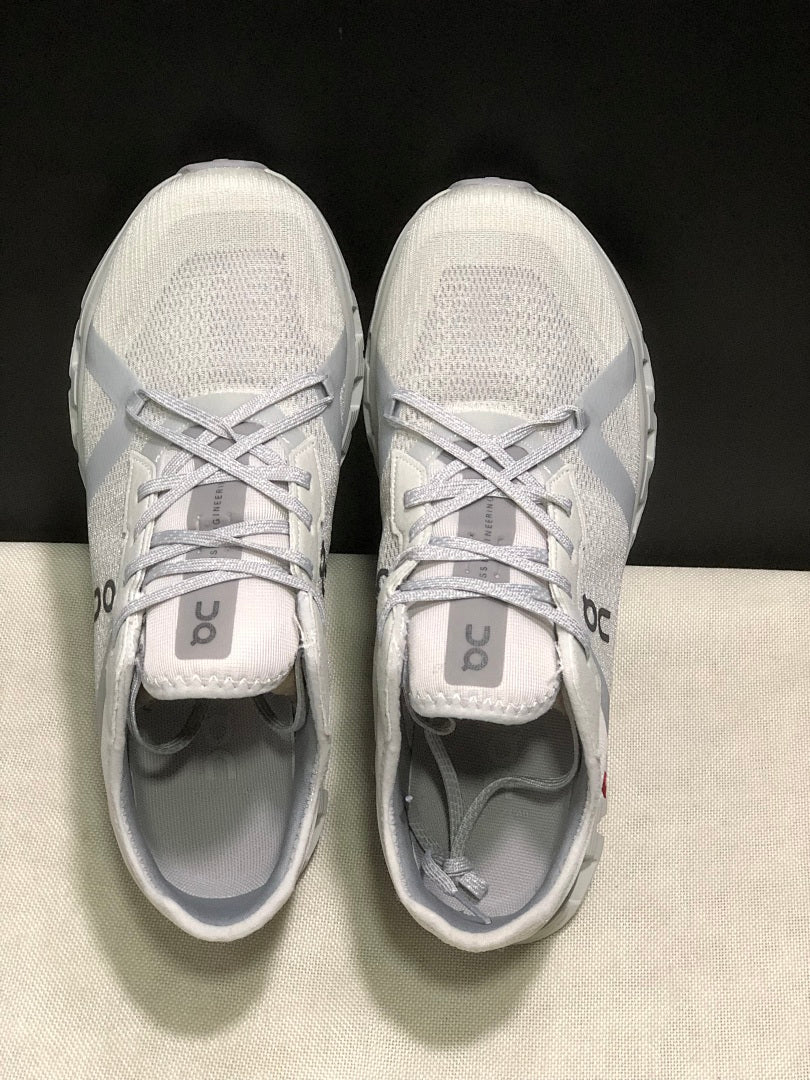 On Cloud X 4 AD Sneakers in Wolf/Alloy in Light Gray - product image from the listing.