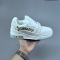 Louis Vuitton Low-Cut Sneakers in White with Floral or Black Trim - product image from the listing.