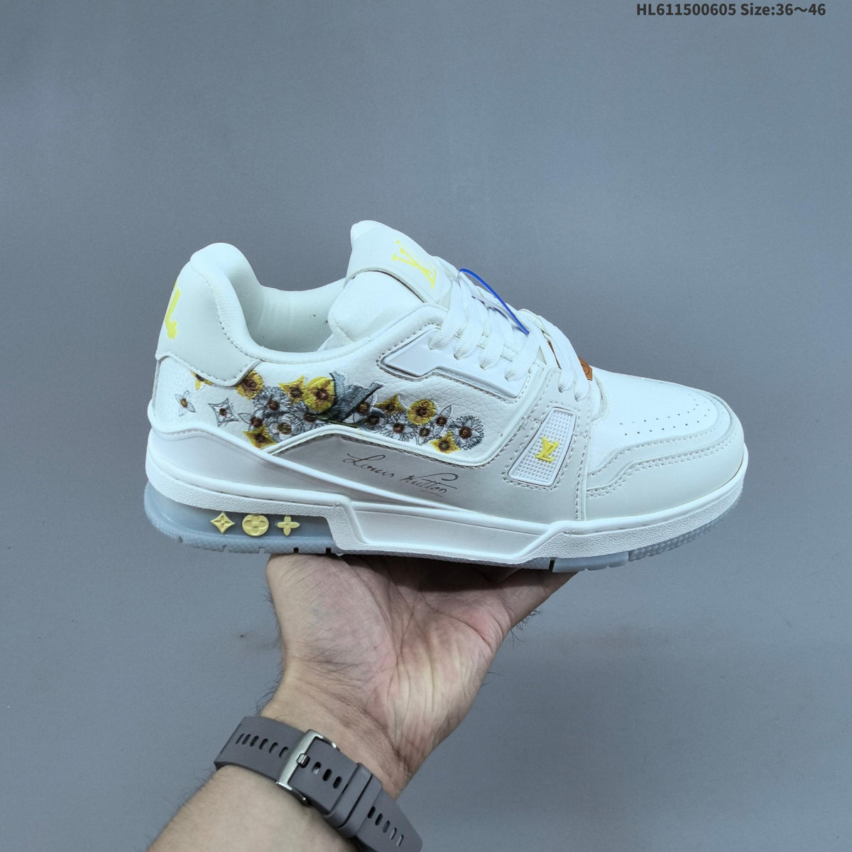 Louis Vuitton Low-Cut Sneakers in White with Floral or Black Trim - product image from the listing.