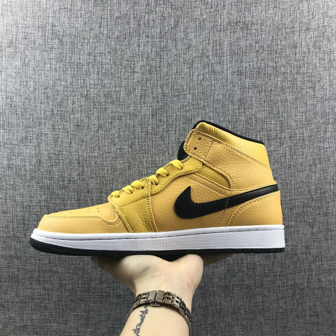 Air Jordan 1 Mid Yellow Ochre Sneakers in Black 554724-700 - product image from the listing.