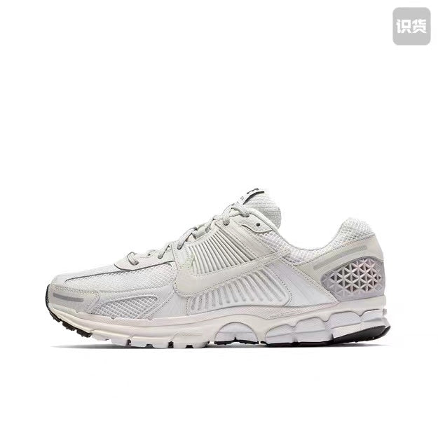 Nike Zoom Vomero 5 Sneakers in Grey and White - product image from the listing.