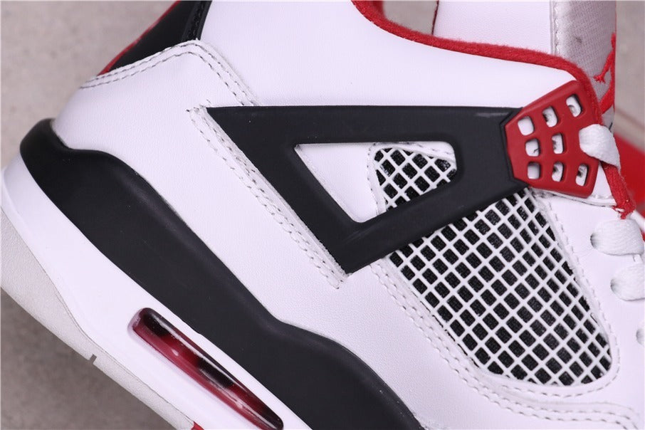 Air Jordan 4 Retro White Red Black Sneakers - product image from the listing.