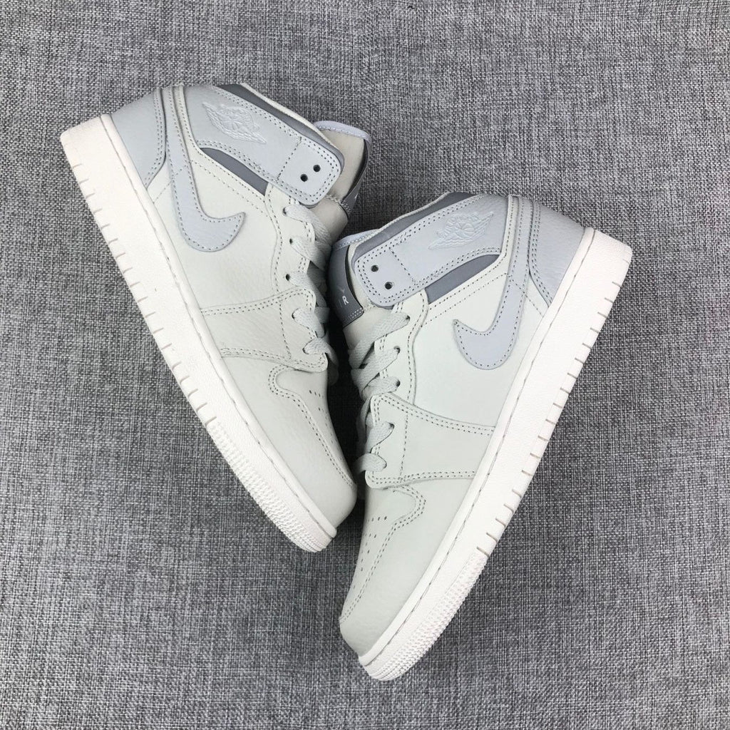 White and Grey Air Jordan 1 Mid Sneakers - product image from the listing.