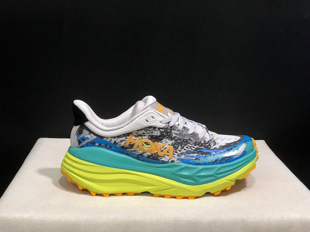 Blue and Lime HOKA Stinson 7 Trail Sneakers - product image from the listing.