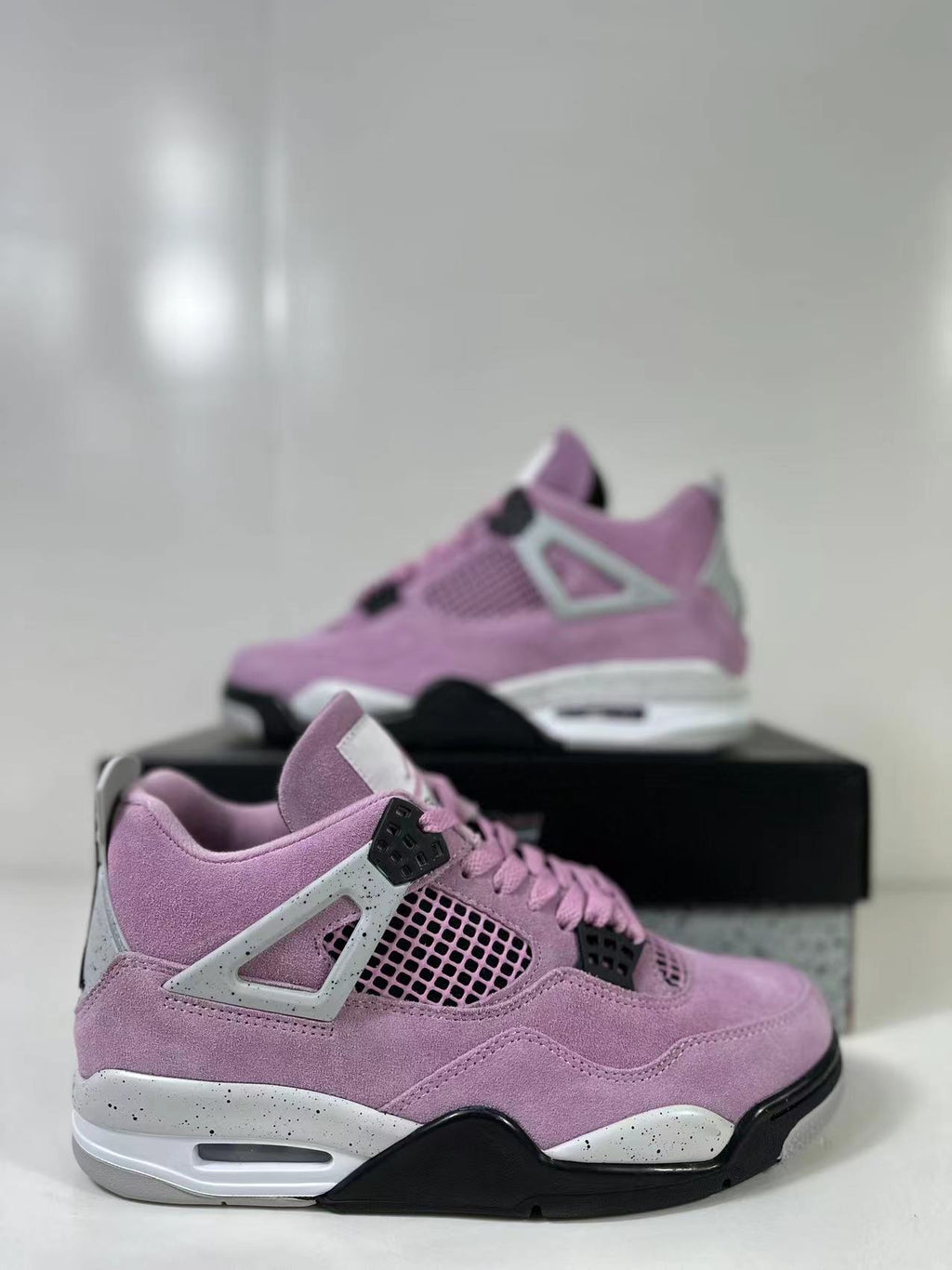 Air Jordan 4 Retro Orchid Pink Sneakers AQ9129-501 - product image from the listing.