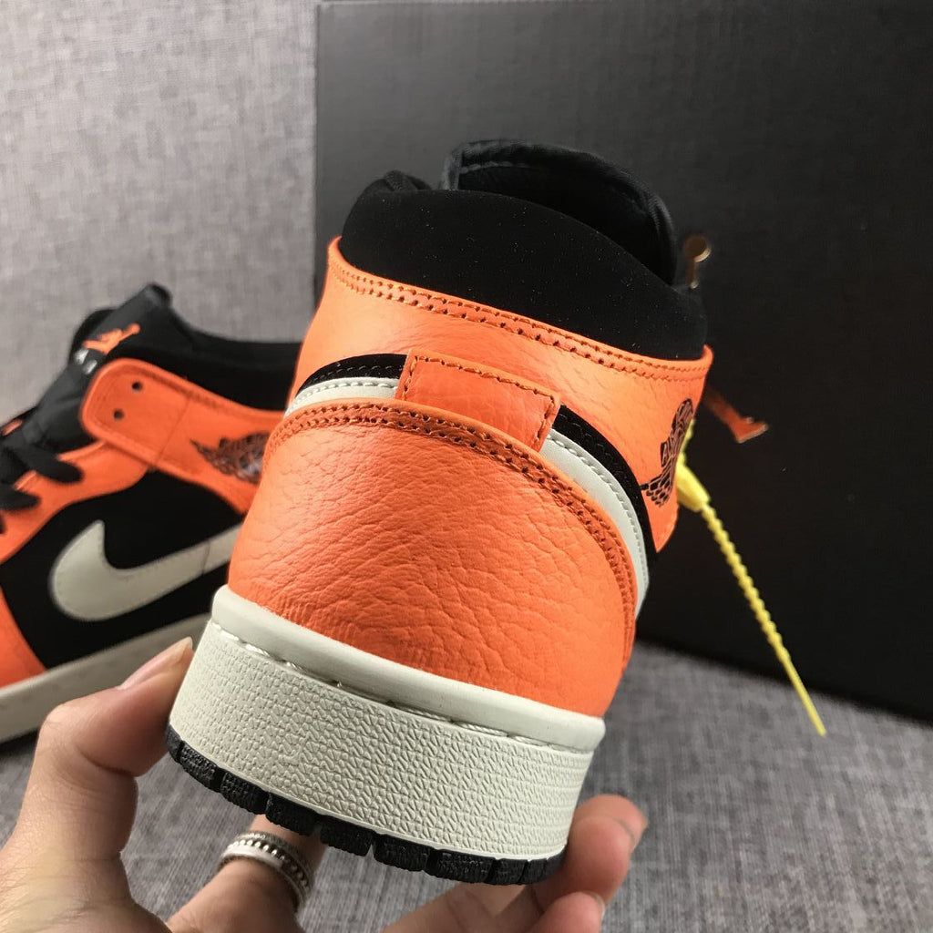 Air Jordan 1 Mid Shattered Backboard Sneakers, in Black and Orange - product image from the listing.