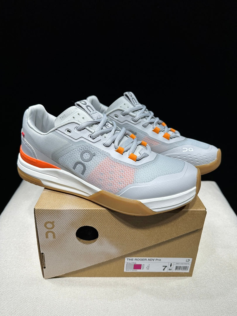 On THE ROGER Advantage Pro Tennis Shoes, in Grey and Orange - product image from the listing.