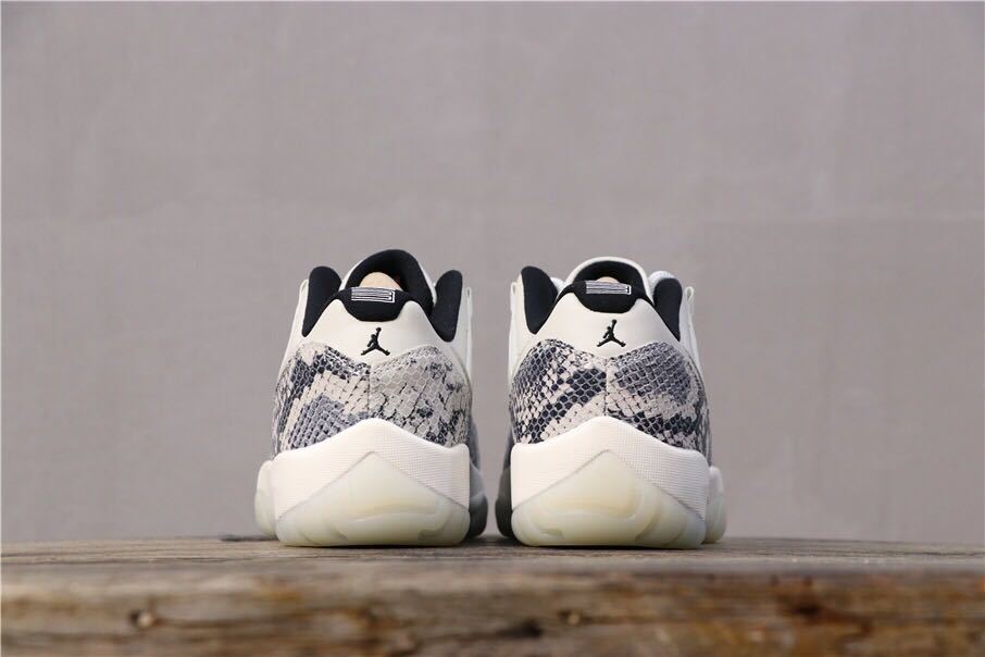 Air Jordan 11 Retro Low White Black Snakeskin Sneakers - product image from the listing.