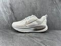 White Nike ZoomX Running Shoes - product image from the listing.